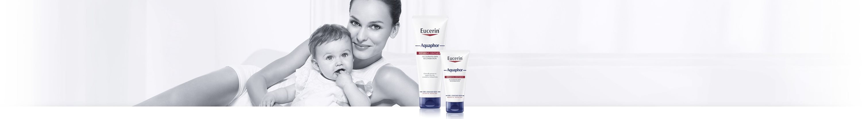 Woman and baby with Aquaphor products